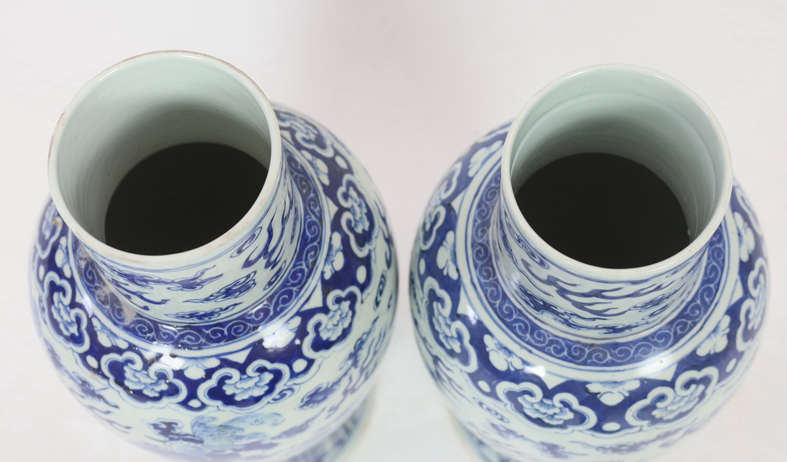 A pair of large Chinese blue and white ‘Buddhist lion’ vases and covers, 19th century, glaze imperfections